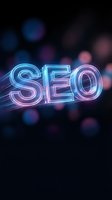 Glowing neon SEO text with colorful bokeh lights on dark background for digital marketing and search engine optimization concepts.