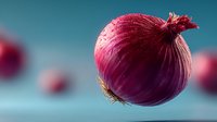 Red onion bulb with papery skin floating against soft blue background with blurred onions creating depth and culinary cooking concept for healthy nutrition.