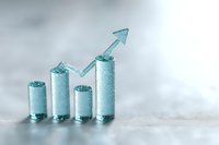 Frosted glass cylinders arranged as ascending bar chart with upward arrow, symbolizing business growth and success on light background with copy space.