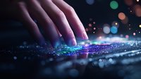 Hand reaching toward glowing digital particles with colorful bokeh lights creating futuristic technology and innovation concept for modern design projects.
