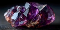 Purple amethyst crystal cluster with translucent faceted gemstones on dark background for jewelry design, healing practices, and mineral collection displays.