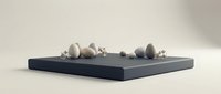 Minimalist zen composition with smooth stones and white flowers arranged on dark platform against neutral background for meditation and wellness concepts.