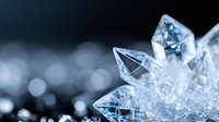 Macro shot of natural quartz crystal formation with sharp translucent points against dark background with bokeh lights, showing mineral structure and clarity.