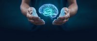 Hands protecting glowing digital brain hologram representing artificial intelligence, mental health, neuroscience and cognitive technology innovation.