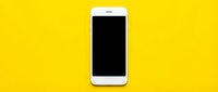 White smartphone with black screen on bright yellow background, isolated and ready for app mockups, web design, and digital marketing materials.
