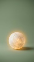 Luminous sphere with warm golden light and delicate wire pattern inside, glowing against soft sage green background for modern design and lighting concepts.
