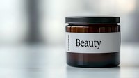Amber glass cosmetic jar with minimalist "Beauty" label on blurred background, showcasing modern skincare packaging for organic products.