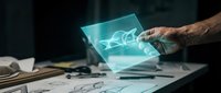 Engineer or architect with brown skin examining holographic digital blueprint projection on transparent tablet device at workspace desk.
