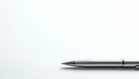 Sleek silver ballpoint pen on clean white background for business writing and office supplies marketing materials.