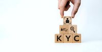Hand placing wooden blocks spelling KYC with compliance icons for know your customer verification and financial regulation processes.
