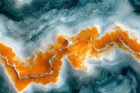 Abstract aerial view of orange and teal marble texture with natural flowing patterns and white veining creates dramatic contrast for luxury design projects.