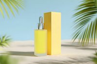 Yellow serum bottle with dropper and packaging on sandy beach with palm leaves against blue sky background. Tropical skincare concept.