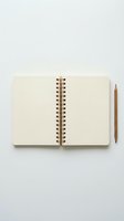 Open blank spiral notebook with wooden pencil on white background for writing, planning, journaling, note-taking, creative projects and office work.