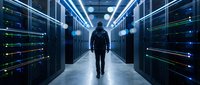 Young male IT professional walking through modern data center with illuminated server racks, representing cloud computing, cybersecurity, and network infrastructure management.
