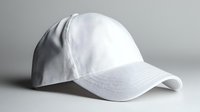 Clean white baseball cap on light background, isolated sportswear accessory with curved brim and adjustable closure for mockup and design projects.