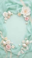 Elegant mint green silk fabric frame with delicate roses, pearls and lace ribbons creating romantic border for wedding invitations and feminine designs.