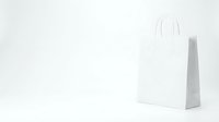 White paper shopping bag with handles on clean background for retail branding and commercial use.