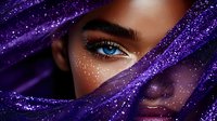 Young woman with blue eyes and glowing skin wrapped in purple cosmic fabric with stars and sparkles for fantasy makeup and beauty concepts.