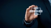 Businessman hand touching virtual network connection icons representing digital technology, cloud computing and data management solutions for modern business.