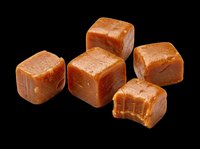 Soft caramel candy cubes isolated on transparent background, ready for stickers, print on demand, T-shirt design, clipart, and sublimation projects.