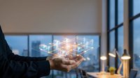 Business professional holding glowing network connections in modern office environment representing digital transformation and connectivity solutions.