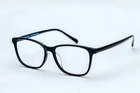 Modern black eyeglasses with square frames isolated on white background, clear lenses and sleek design for optical and vision care concepts.