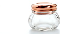 Empty glass jar with rose gold metallic ribbed lid on white background, minimalist kitchen storage container for preserves and spices, isolated product photography.