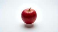 Fresh red apple with water droplets isolated on white background, ready for food and nutrition design projects.