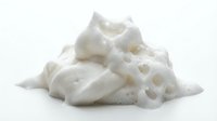 Pile of white foam packing peanuts isolated on white background, ready for design mockups, packaging materials, and shipping protection concepts.