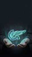 Glowing turquoise energy swirls floating above cupped hands in dark atmospheric setting for spiritual and mystical concepts.