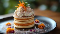 Gourmet layered dessert with cream filling and carrot garnish on elegant plate. Professional food photography for restaurant menus and culinary presentations.