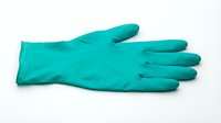 Turquoise latex protective glove isolated on white background, ready for design use on merchandise, apparel, and promotional materials.