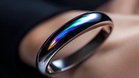 Sleek metallic ring with iridescent rainbow reflection on polished surface against soft beige background, modern jewelry photography with selective focus.