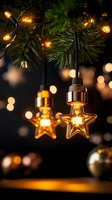 Glowing star-shaped LED bulbs hanging on Christmas tree branches with warm bokeh lights and ornaments in dark background, creating festive atmosphere.