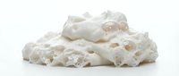 Isolated white porous mineral rock formation with natural cavities and textured surface, suitable for geology education, design backgrounds, and scientific illustrations.