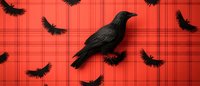 Black raven silhouette on red plaid background with flying crow silhouettes creating spooky Halloween atmosphere. Gothic style decorative pattern.
