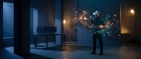 Man in suit interacting with holographic digital network interface displaying glowing data connections and nodes in modern office environment for business technology presentations.