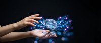 Human hands holding glowing digital brain with neural network connections and data streams on dark background for technology and AI concepts.