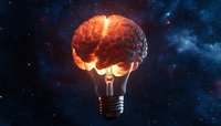 Glowing brain-shaped light bulb against starry cosmos background illustrates creative thinking and innovation concept with orange energy patterns.