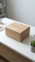Cardboard shipping box on white desk in modern office workspace ready for delivery or online business package.