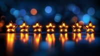 Glowing golden star lights arranged in row with reflection on dark surface against blurred blue bokeh background creating festive atmosphere.