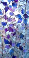 Delicate leaves in shades of blue and purple create an ethereal pattern against soft light. Translucent foliage design suitable for window film, fabric prints and wallpaper.