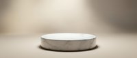 Empty concrete podium with white surface on neutral beige background, suitable for product display, mockups, and promotional presentations.
