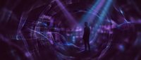 Silhouette of a man standing in a digital tunnel with glowing purple and blue light rays, representing technology, innovation, and future business concepts.