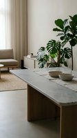 Modern minimalist living room with wooden coffee table, ceramic bowls, monstera plant and neutral beige sofa creating serene scandinavian home interior.