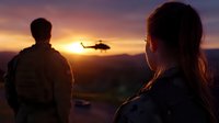Silhouettes of man and woman watching helicopter flying against dramatic sunset sky over mountain landscape, creating atmospheric cinematic scene.