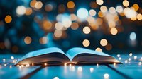 Open book with glowing fairy lights creating magical bokeh effect against dark blue background, pages illuminated by warm golden lights for cozy reading atmosphere.