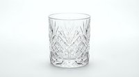 Crystal cut glass tumbler with diamond pattern isolated on white background for luxury drinkware and elegant dining presentations.