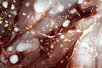 Luxurious brown and gold marble texture with flowing abstract pattern. Metallic gold veins and white bubbles create elegant swirls on dark chocolate background.