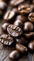 Fresh roasted coffee beans macro shot showing rich brown color and distinctive groove texture on rustic wooden surface. Natural morning light highlights details.